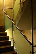 Satin finish stainless steel balustrade with tubular handrail, satin glass infill.