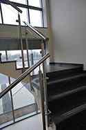 Stainless steel glass balustrade with high polished tubular posts and handrail. Toughened safety glass infill panels.
