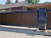 Cantilever sliding gate and wicket from galvanized steel with filling from wood-plastic composites (WPCs)