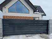 Cantilever sliding gate and wicket from galvanized steel with metal sheet filling