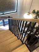 Winder stairs with steel supporting structure and wooden steps.