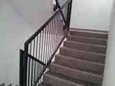 Steel balustrade with vertical bars in stairwell