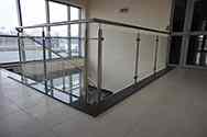 Stainless steel glass balustrade with toughened glass filling at the top of stairwell