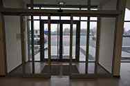 Sliding door at the entrance to the building in aluminum system.