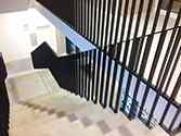 Powder painted steel balustrades in the stairwell of western pylon