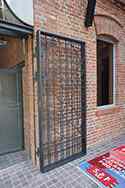 Steel door with powder painted steel frame and filling made from steel bars