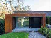 Entrance to the house cladded with corten steel panels