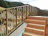 Steel balustrade with filling from perforated aluminum sheets powder painted on a rooftop terrace