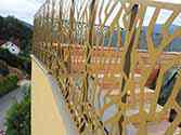 Steel balustrade with panels from perforated aluminum sheets installed on a rooftop terrace