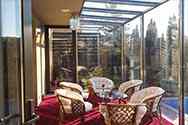 Glass conservatory built on house veranda