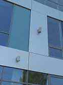 Façade panels of clear and colored glass as well as Alucobond