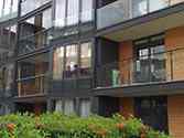 Balcony steel glass balustrade with glass infill and juliet glass balconies mounted to the facade