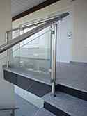 Stainless steel balustrade with posts and glass panels of the infill
