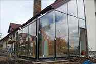 Steel frame structure of outer walls from stainless steel glazed with laminated safety glass