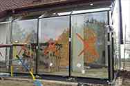 Outer walls from stainless steel frame glazed with laminated safety glass