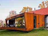 corten façade, facade of the house extension with a terrace cladded with cassettes of corten steel