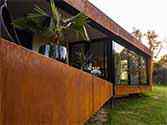 terrace with façade cladded with corten steel cassettes