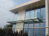 balcony  with stainless steel construction, glass flooring and frameless glass railing