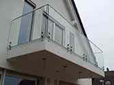 frameless glass balustrade with stainless steel top rail on balcony
