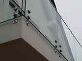 frameless glass balustrade with stainless steel anchors for side fixing
