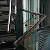 handrail from stainless steel high polished tube mounted to self-supporting glass panels