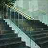 frameless glass balustrade with wooden handrail