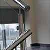 stainless steel high polished tubular handrail mounted to posts with handrail supports