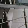 stainless steel handrail mounted to posts with handrail supports