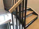 wooden steps and landings, steel railing with wooden handrail