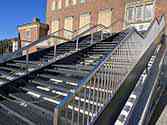 cheek staircase from galvanized and painted steel with steps from steel grid