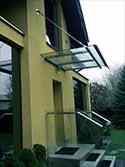 glass canopy with support construction and tension rods