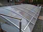 polycarbonate panels installed on top of steel structure with stainless steel flats