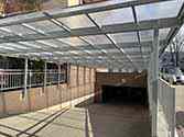 roof over driveway to the underground car park made of polycarbonate plates mounted on steel structure