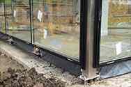 glass panels mounted to columns from steel profiles