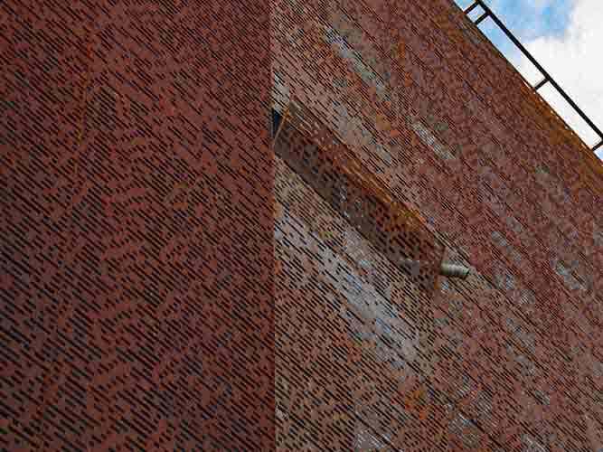 Corten facade. Swivelling element of the façade