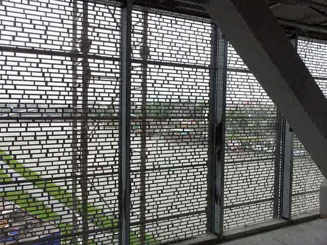 Corten steel façade plates perforated up to 69% at the part where a viewing platform is located