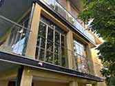 Balcony steel glass railing with stainless handrail and posts