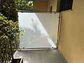 Glass partition with stainless steel frame