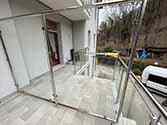 Glass partition with stainless steel frame